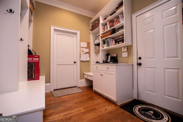 mudroom featuring light hardwood / wood-style floors and ornamental molding