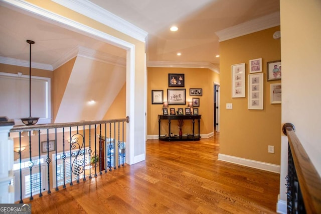 hallway featuring crown molding and wood-type flooring