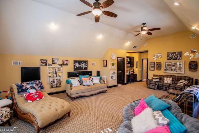 living room featuring carpet floors, ceiling fan, and vaulted ceiling