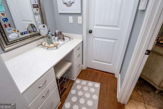 bathroom featuring vanity and hardwood / wood-style flooring