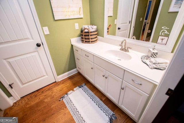 bathroom featuring vanity and hardwood / wood-style floors