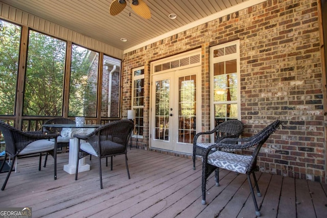 sunroom featuring french doors and ceiling fan