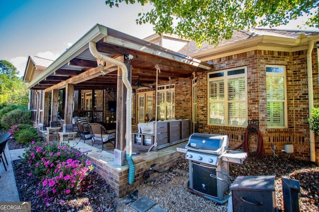 view of patio / terrace featuring outdoor lounge area, area for grilling, and ceiling fan