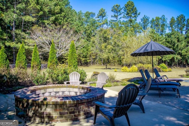 view of patio / terrace with a fire pit