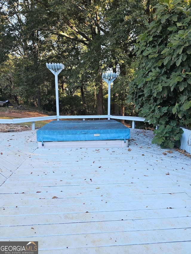 view of swimming pool featuring a deck