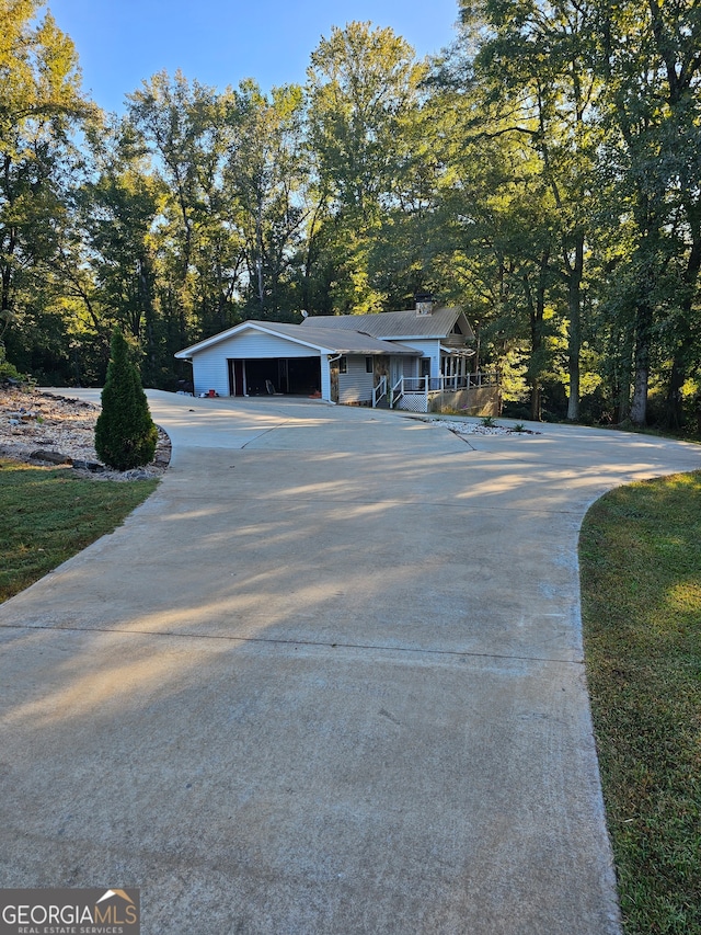 view of front of property with a carport