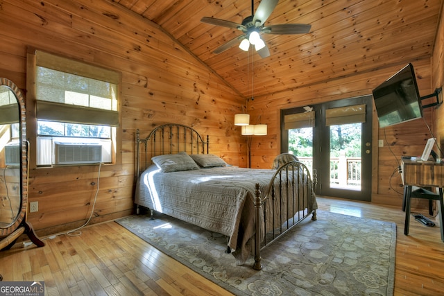 bedroom with wood ceiling, multiple windows, and light hardwood / wood-style floors