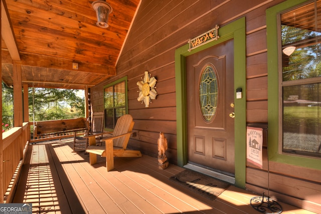 entrance to property featuring a porch