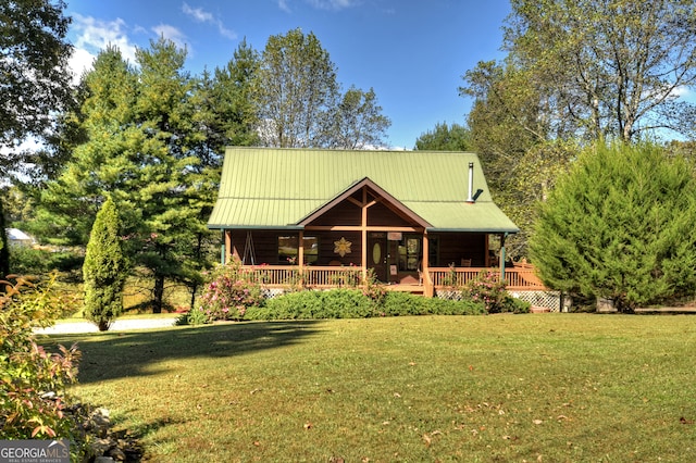 log cabin featuring a front lawn