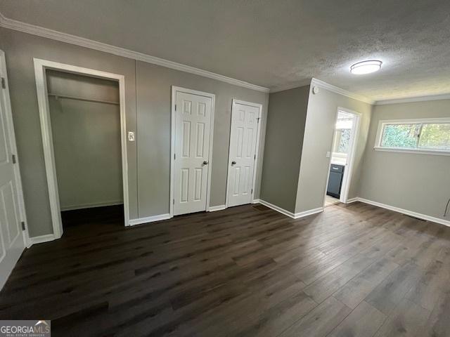 spare room with dark wood-type flooring