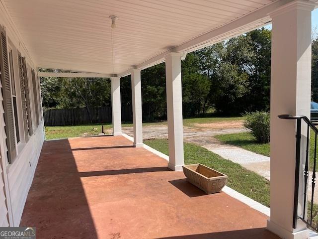 view of front of house featuring a front lawn and a sunroom