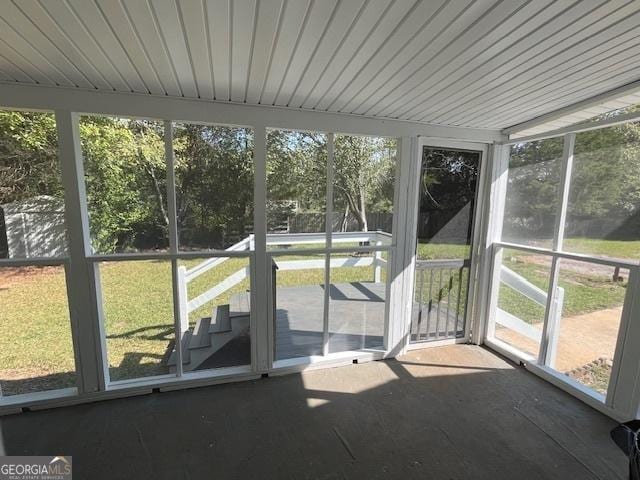 unfurnished sunroom featuring plenty of natural light