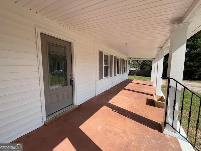 view of patio featuring a porch