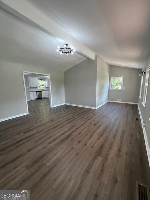 unfurnished living room with visible vents, vaulted ceiling with beams, baseboards, a chandelier, and dark wood-style floors