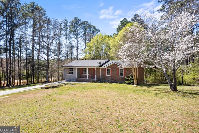 2420 Green Rd, Loganville, GA 30052 - single story home featuring a front lawn