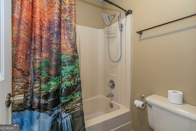 bathroom featuring toilet and shower / bath combination with curtain