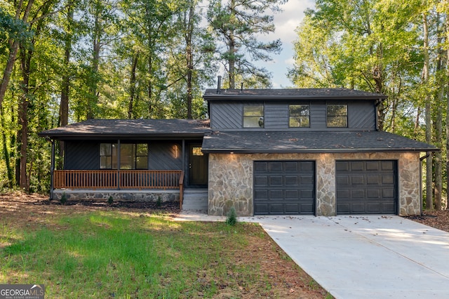 view of front of home featuring a porch and a garage