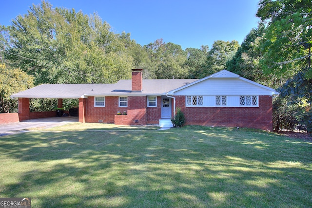 single story home with a front lawn and a carport