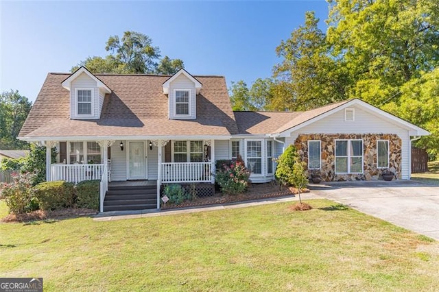 new england style home with a front lawn and a porch