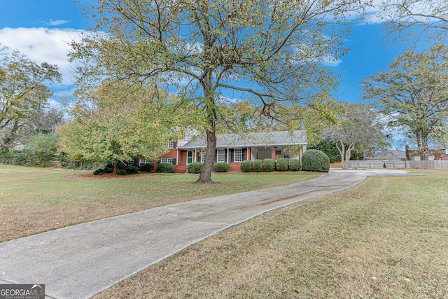 single story home with a front yard