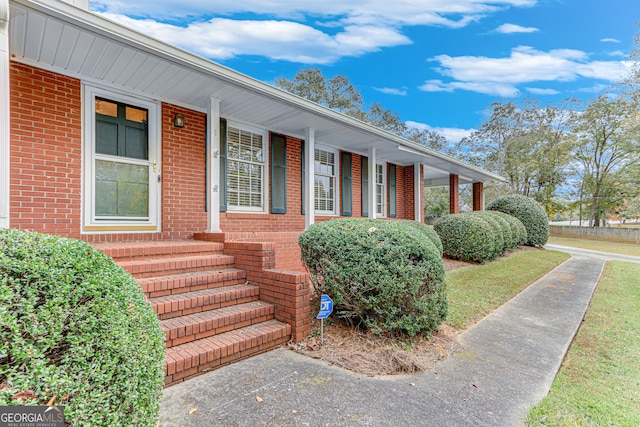 entrance to property with a porch