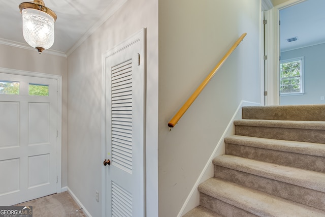 interior space with plenty of natural light, light carpet, and crown molding