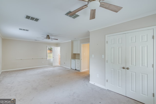 unfurnished living room featuring light carpet, crown molding, and ceiling fan