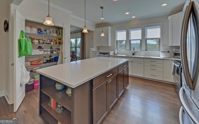 kitchen with white cabinetry, a healthy amount of sunlight, a center island, and dark hardwood / wood-style flooring