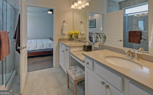 bathroom with vanity, an enclosed shower, hardwood / wood-style floors, and ceiling fan