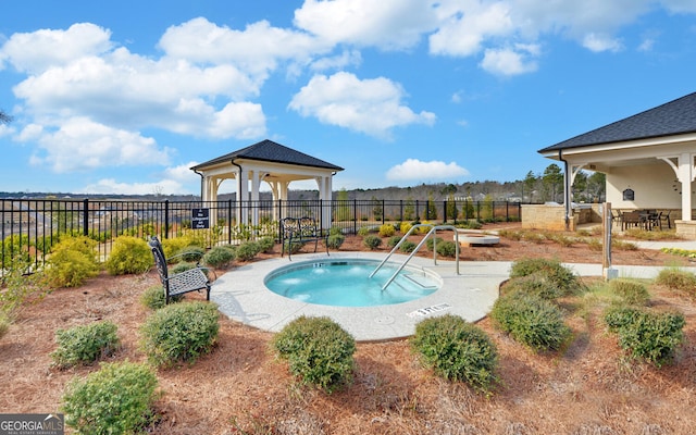 view of swimming pool featuring an in ground hot tub, a gazebo, and a patio