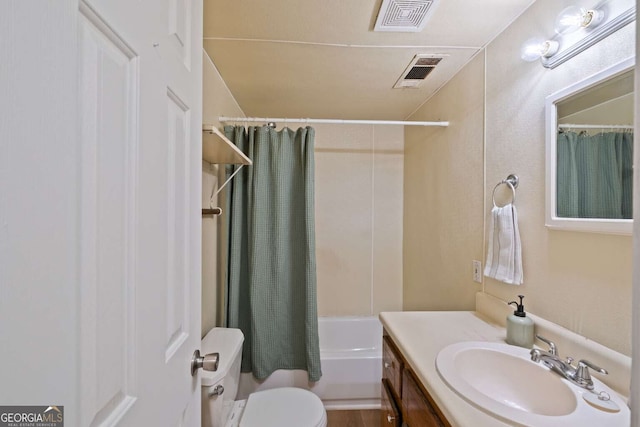 full bathroom with shower / bath combo, vanity, and toilet