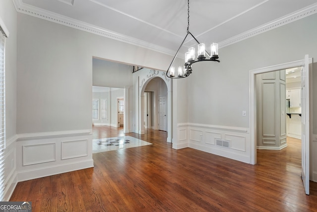 unfurnished dining area with crown molding and dark hardwood / wood-style floors