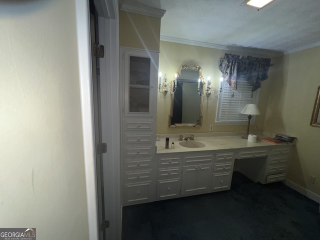 bathroom featuring vanity, ornamental molding, and a textured ceiling