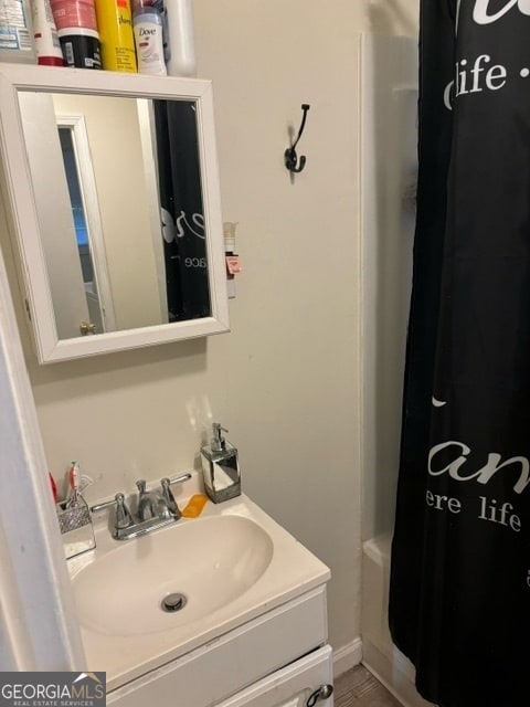 bathroom with vanity and shower / bathtub combination with curtain