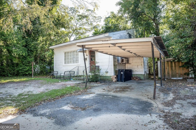 view of parking / parking lot with a carport