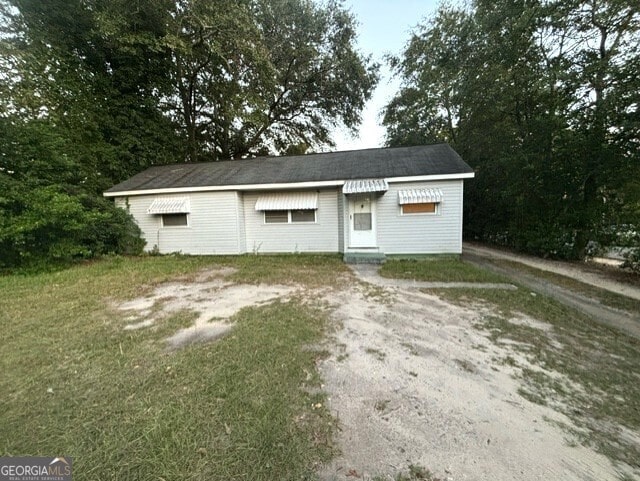 garage featuring a lawn