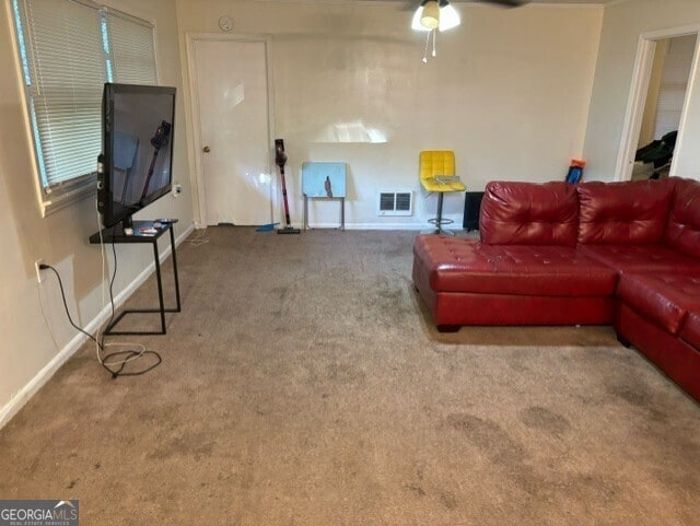 living room with carpet and ceiling fan