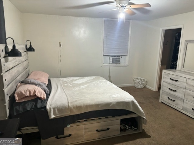 carpeted bedroom featuring ceiling fan and cooling unit