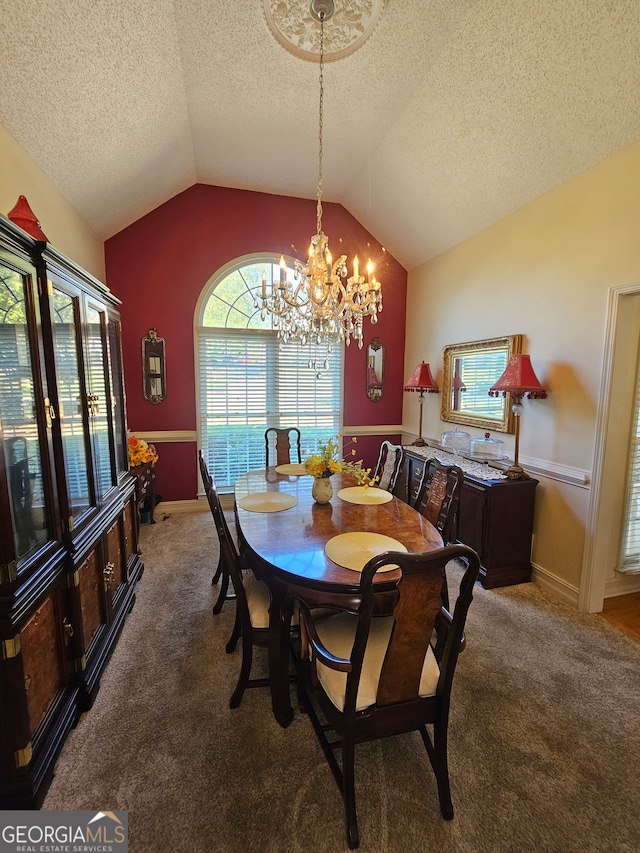 dining room featuring a notable chandelier, a textured ceiling, lofted ceiling, and carpet floors