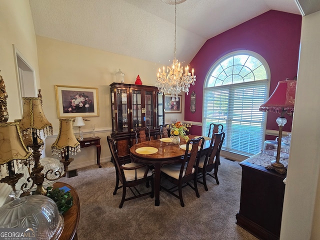 carpeted dining room featuring an inviting chandelier and vaulted ceiling