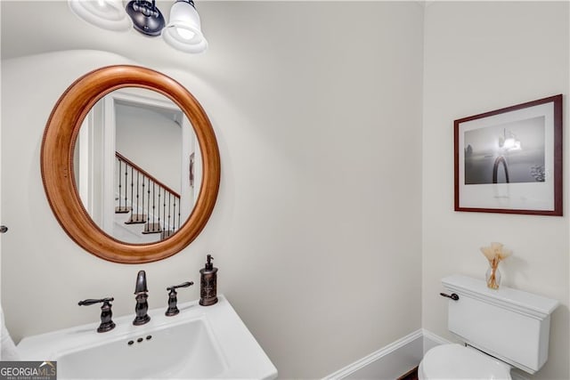 bathroom featuring toilet and sink