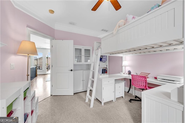 home office with built in desk and ceiling fan