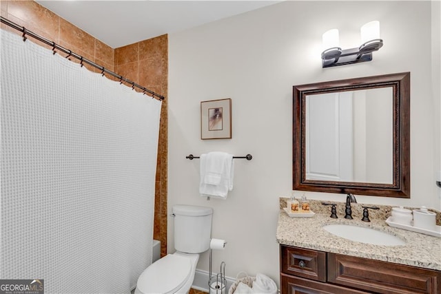 full bathroom with vanity, shower / tub combo, and toilet