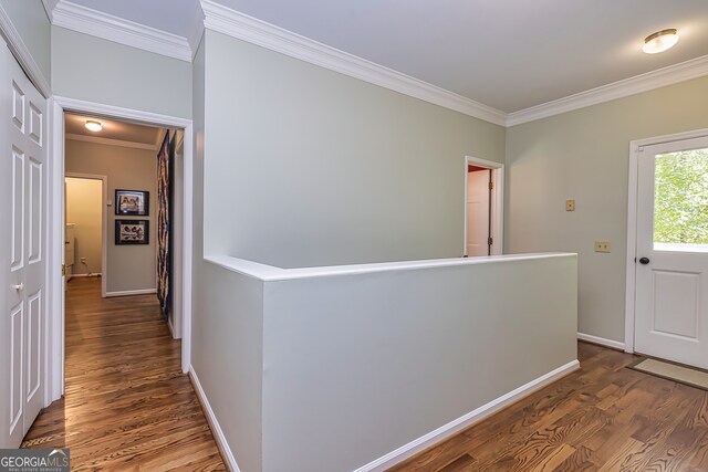 hallway featuring dark hardwood / wood-style floors and ornamental molding