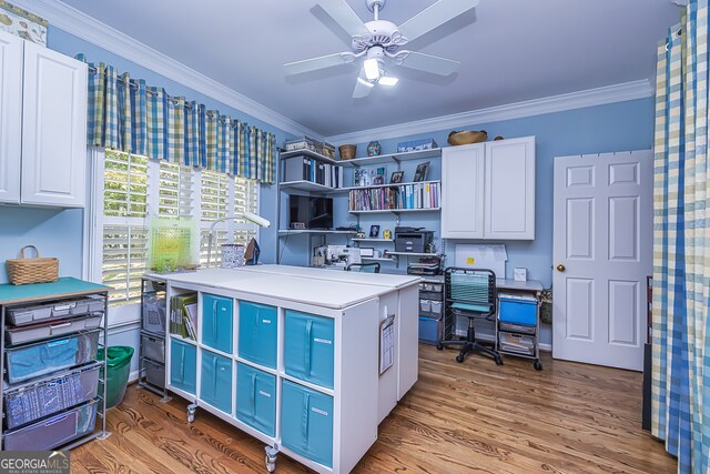 office area featuring hardwood / wood-style floors, ceiling fan, and crown molding