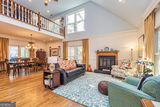 living room featuring a wealth of natural light and high vaulted ceiling