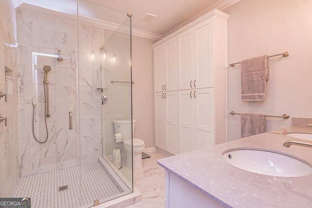 bathroom featuring toilet, vanity, an enclosed shower, and crown molding