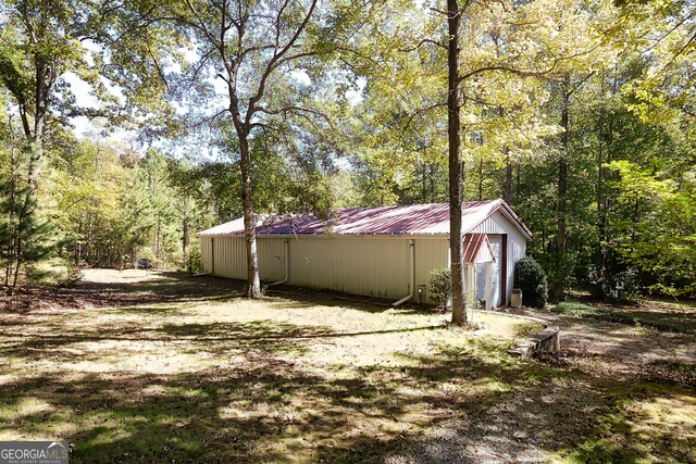 view of side of property with an outbuilding and a garage