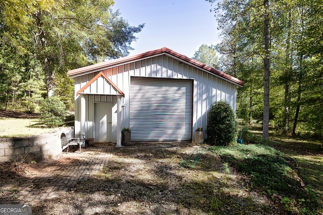 exterior space featuring an outbuilding and a garage