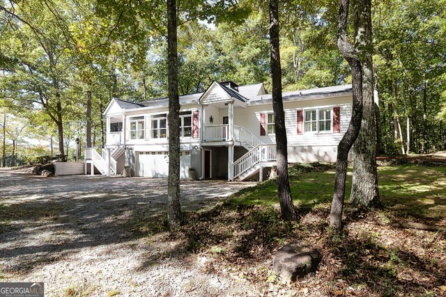 view of front of house featuring a sunroom